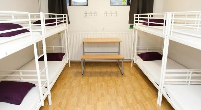 Кровать в общем номере The Capital-Inn