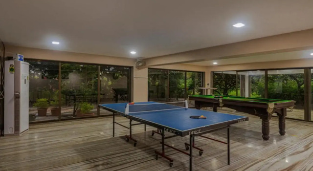 SaffronStays Aura, 4 BR Luxury Pool Villa with Game Room & Lawn