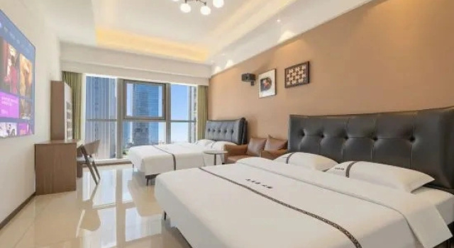 Кровать в общем номере Meet the Sea · Scenic Resort Apartment