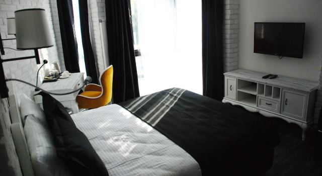 Номер Deluxe Check Inn Suite Hotel & SPA