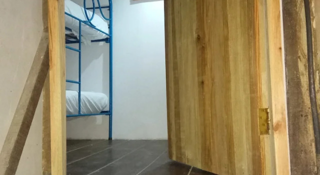 Кровать в общем номере Caribbean Coral Inn Tela