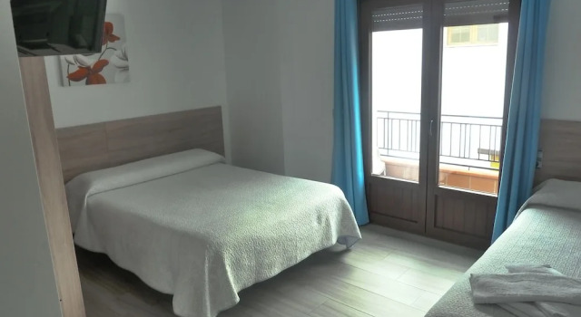 Кровать в общем номере Hostal y apartamentos Casa Fermina