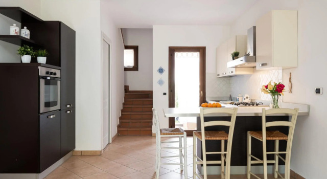 The apartment is located on two floors. The ground floor has a living room with sofa bed, with kitch-TRILO MIRTO, Book Lejlighed Golfo Aranci Emerald Coast