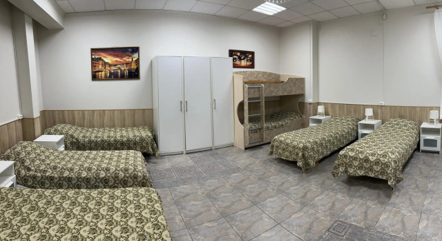 Кровать в общем номере Гостиница Хозяюшка