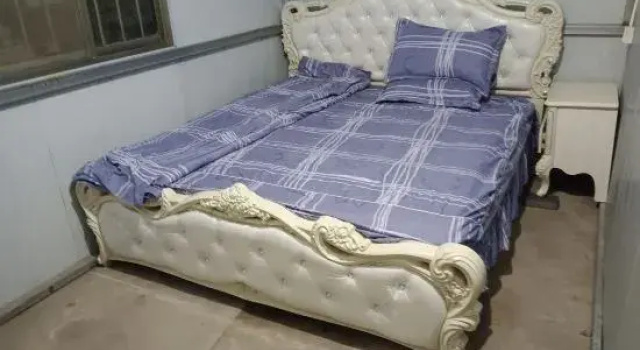 Łóżko w pokoju wieloosobowym Binhai Jinbin Hotel