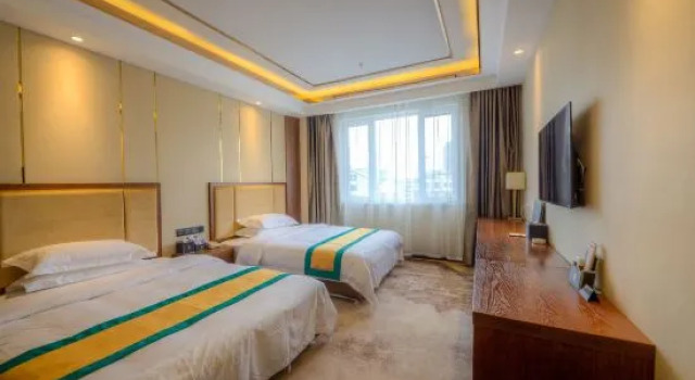 Кровать в общем номере Liaoyuan Hotel