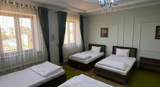 Кровать в общем номере Tomaris