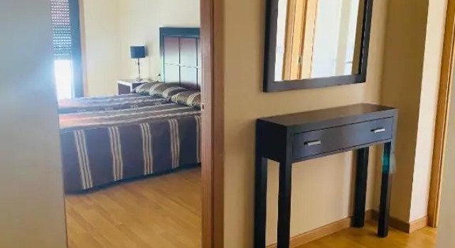Кровать в общем номере Hotel AV Apartamentos Lobios