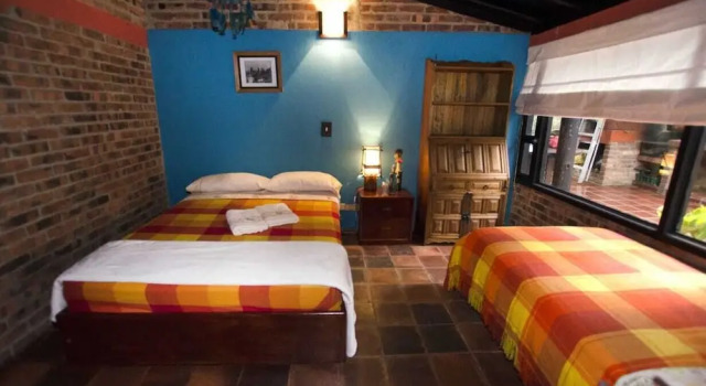 Cama en dormitorio compartido Refugio Explora Verde