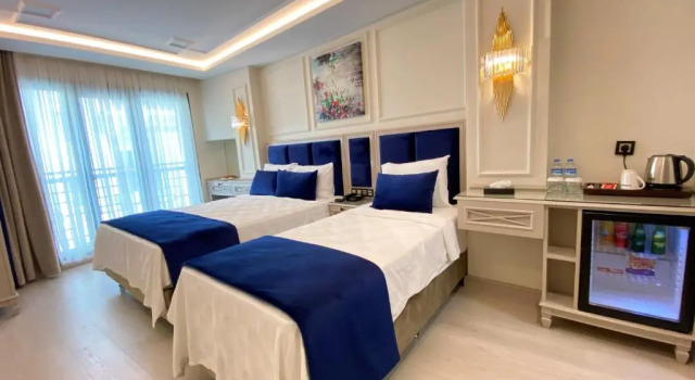 Трёхместный номер Deluxe OMMA HOTEL