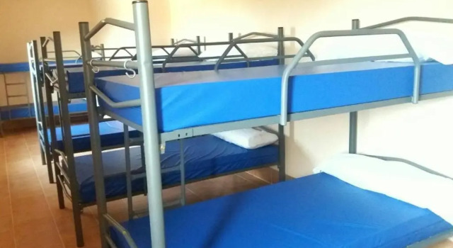 Кровать в общем номере Albergue El Camino de las Estrellas