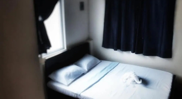 Łóżko w pokoju wieloosobowym Mati Budget Inn