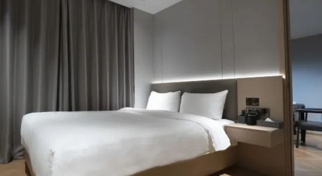 Люкс Deluxe Sanhaoyun Apartment Hotel (Songyuanxia Subway Station Branch)