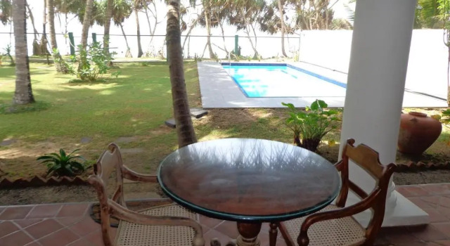 Кровать в общем номере Villa Tissa Beach Resort