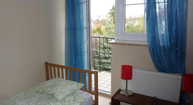 Кровать в общем номере Dandelion B&B