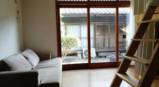 Кровать в общем номере Yuzan Guesthouse
