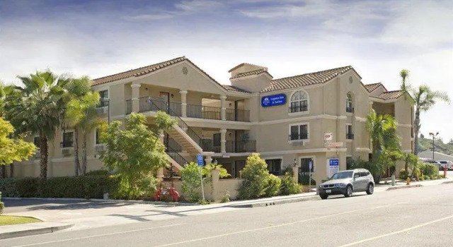 Кровать в общем номере Laguna Inn and Suites