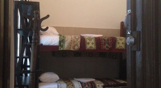 Cama en dormitorio compartido Guesthouse Nelson