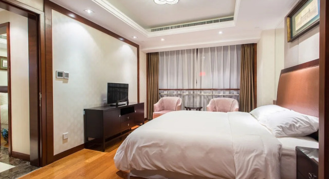Люкс Deluxe с 3 комнатами с видом на город Qingdao Jinshan We Holiday Apt Wusi