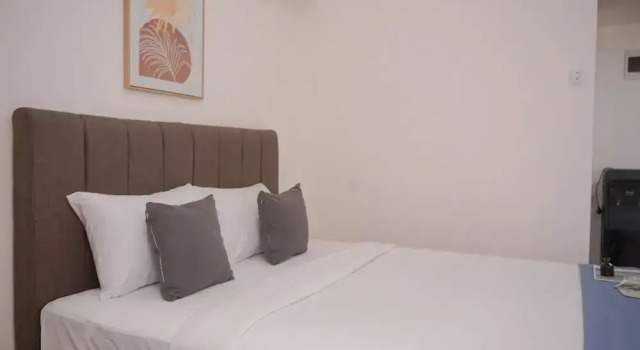 Minimalist And Warm Studio Room At Cisauk Point Apartment