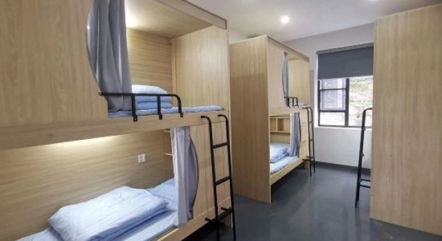 Кровать в общем номере (мужской номер) Muxia Leisure Hotel