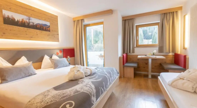Трёхместный номер Berghotel Miramonti