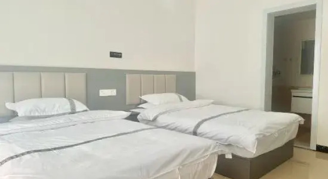 Кровать в общем номере Baili Dujuan Yongfuxuan B&B