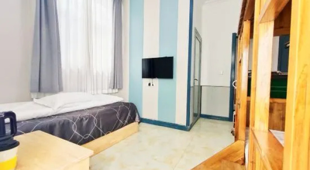 Четырёхместный семейный люкс с красивым видом из окна Yunshang Four Seasons Homestay (Laoshan Yangkou Beach Store)