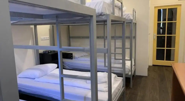 Кровать в общем номере Orange Tulip Hotel