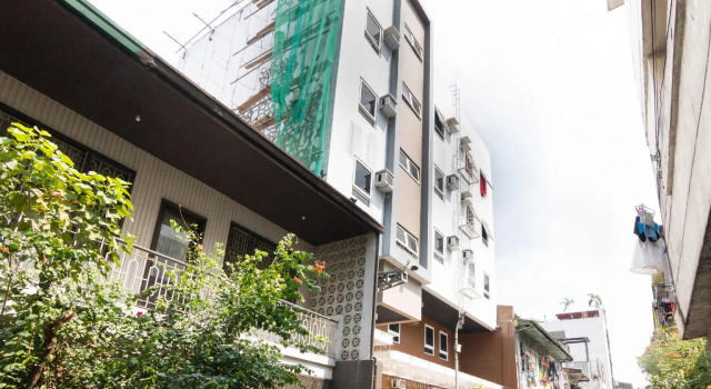 Кровать в общем номере OYO 152 Sangco Condotel