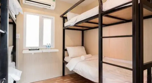Кровать в общем номере Nin Garden Homestay