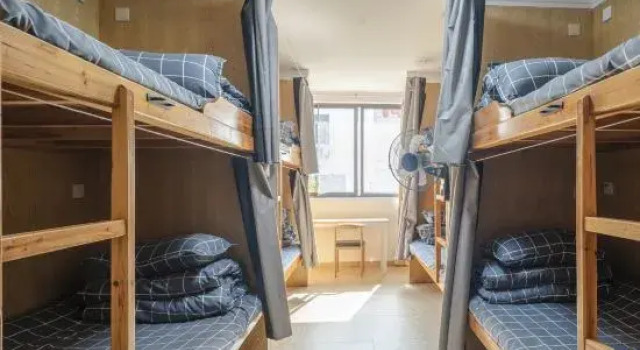Кровать в общем номере Xidi Huaxipan YouthHostel