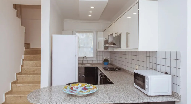 Номер Standard Мансарда с балконом Infinity Olympia Apartments
