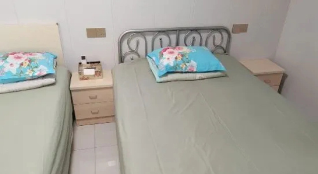 Кровать в общем номере Ruiyu Guesthouse