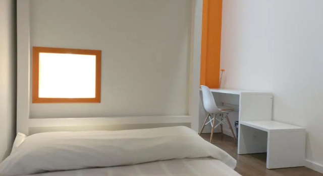 Кровать в общем номере Albergue Xabarín