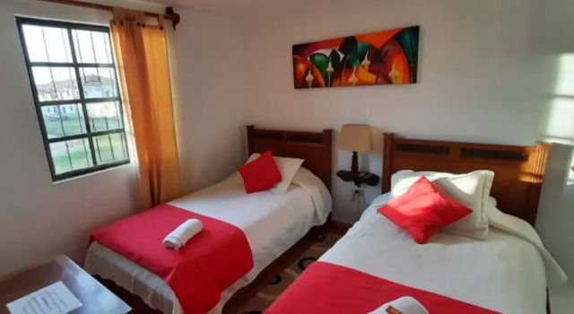 Кровать в общем номере с 6 комнатами Aparta Hotel El Refugio de María