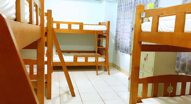 Кровать в общем номере Ai Yin B&B