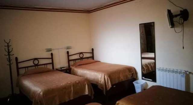 Кровать в общем номере Julia Plaza Hotel