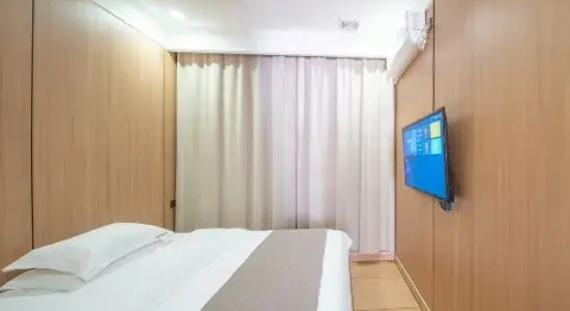 Кровать в общем номере Shenzhen Xingkong Xinyu Hotel