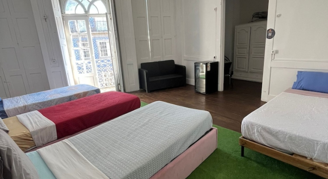 Кровать в общем номере Casa Augusta 2