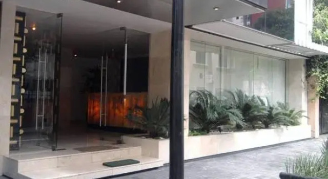 Кровать в общем номере Мансарда Suites Parioli