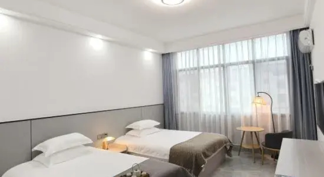 Кровать в общем номере LAN YUE JU Hotel (Mount Longhu Visitor Center)