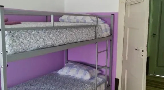 Кровать в общем номере CSI Coimbra & Guest House