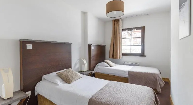 Кровать в общем номере Résidence Lagrange Vacances Les Fermes Emiguy