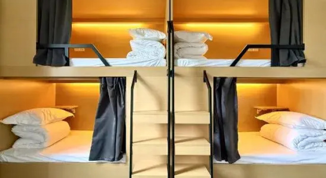 Кровать в общем номере Hemu Guesthouse