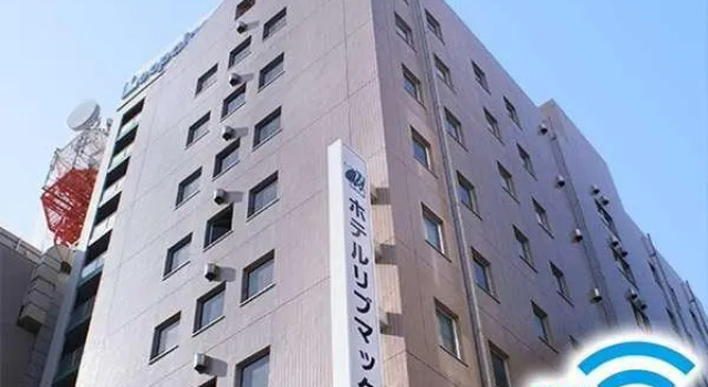 Кровать в общем номере HOTEL LiVEMAX BUDGET Hiratsuka Ekimae