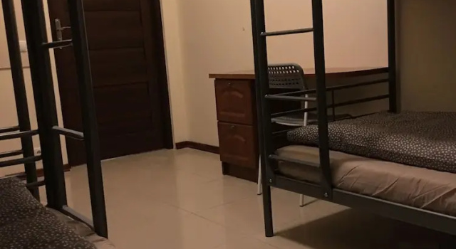 Кровать в общем номере Ametyst Apartments