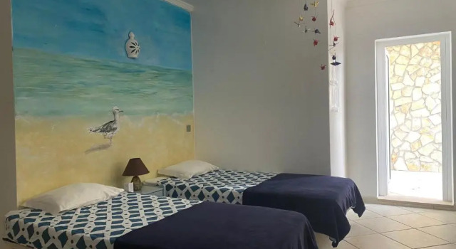 Кровать в общем номере Lagos Marina Guest House