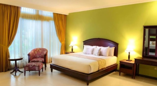 Postel ve společném pokoji pro muže Maharani Guest House