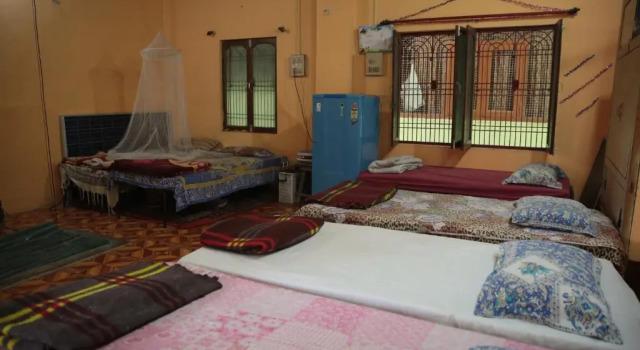 Кровать в общем номере Somit Paying Guest House